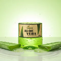 Lepas Aloe Vera soothing gel jar with aloe vera leaves on a green background